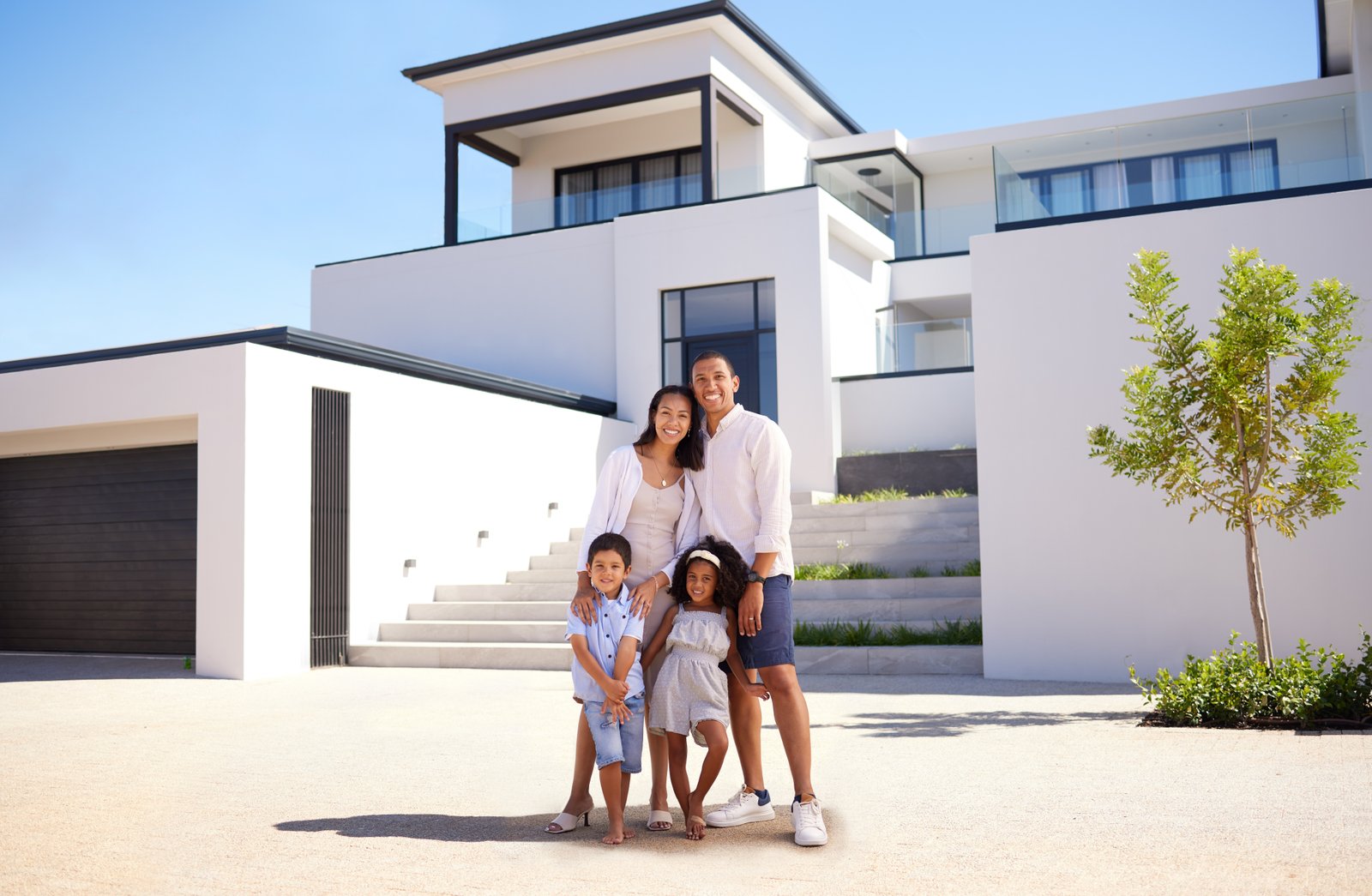 Happy family moving into luxury home